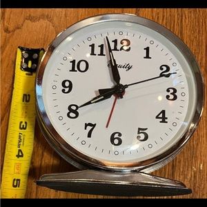 Equity by Lacrosse wind-up battery operated portable tabletop clock.